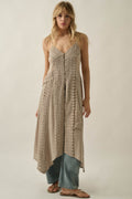 Promesa Up in the Air Maxi Top — Stone. Woman wearing a long, light beige top with lace details over jeans.