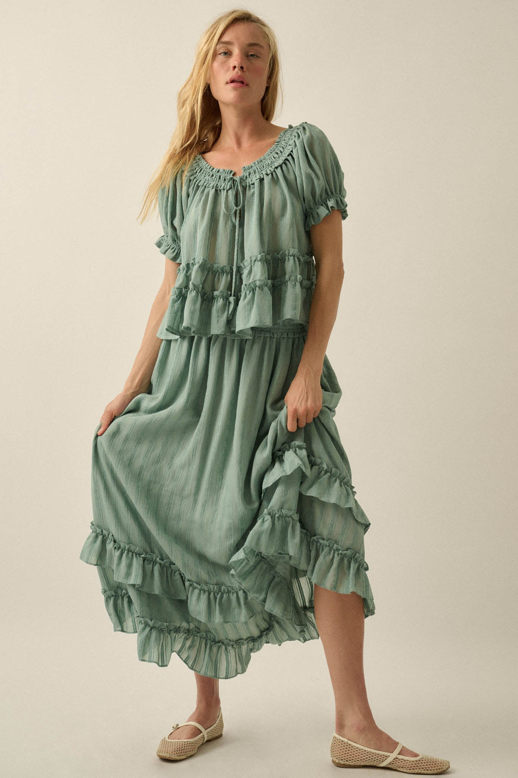 Promesa Precious Days Ruffle Babydoll Top in pine green. Flowing, tiered ruffle dress worn by a blonde woman.