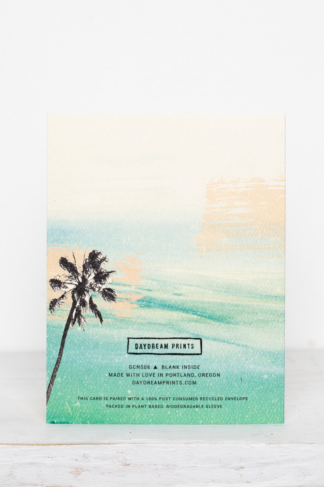 Birthday Vibes Palm Tree Card from Daydream Prints, with a watercolor palm tree silhouette against a teal and peach sky.