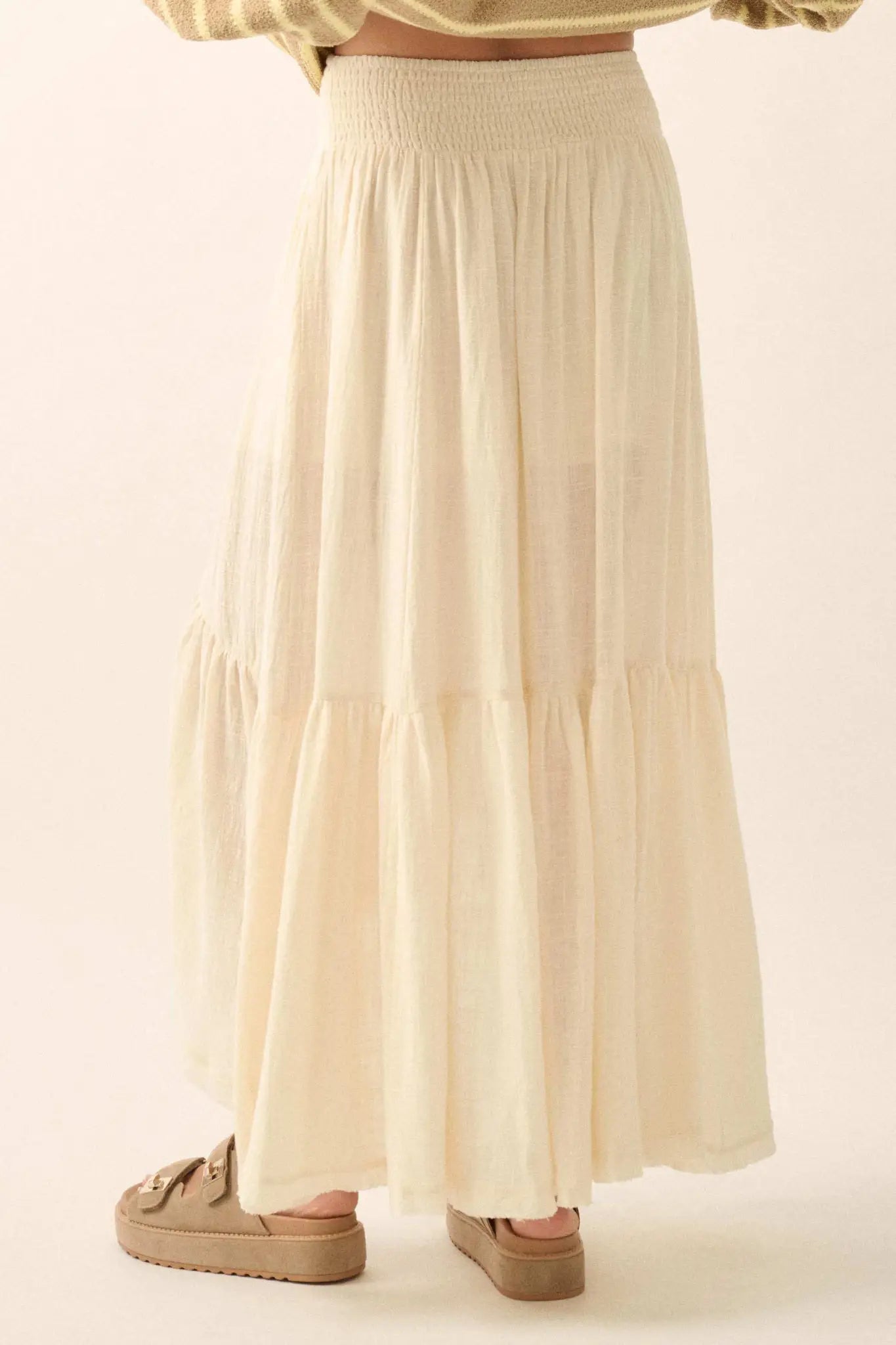Promesa Pretty Precious Ruffle Maxi Skirt in Off White, featuring a smocked waist and tiered ruffle design.