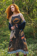Wild Beauty Bohéme Slip Dress by Market of Stars with sunflower, peacock & crane print, worn by a redhead model in a lush setting.