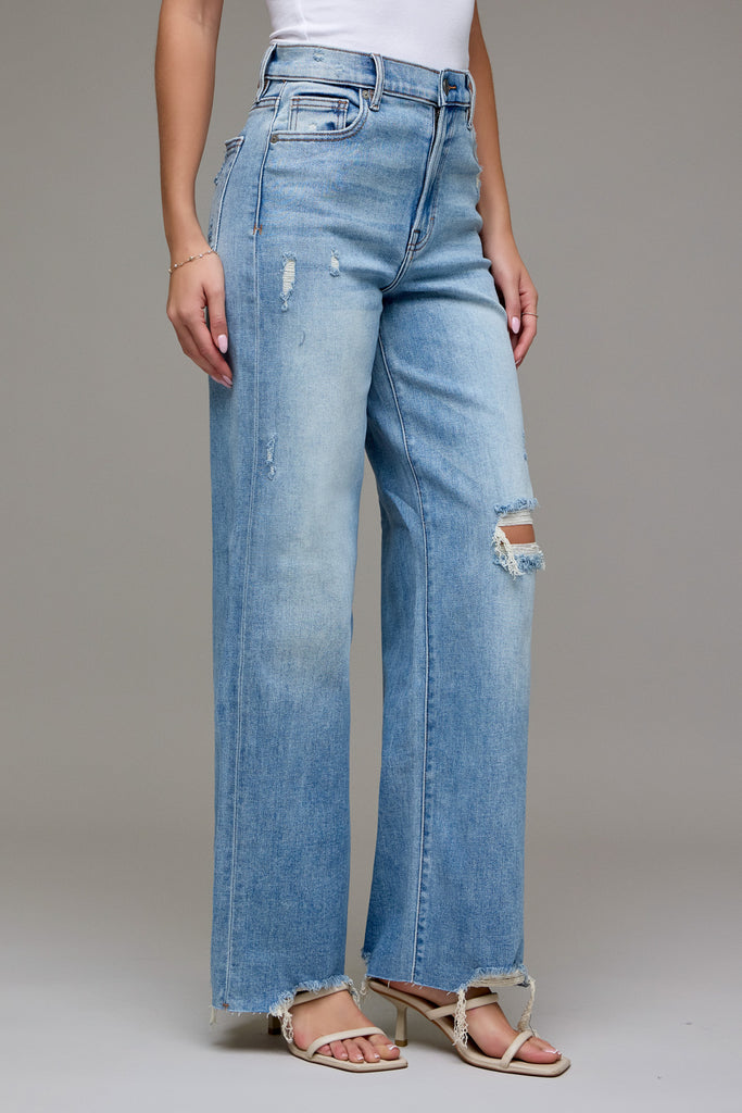 Hidden Jeans Logan Dad Jean Light Wash, high-waisted, wide-leg, distressed jeans with frayed hem and knee rips.