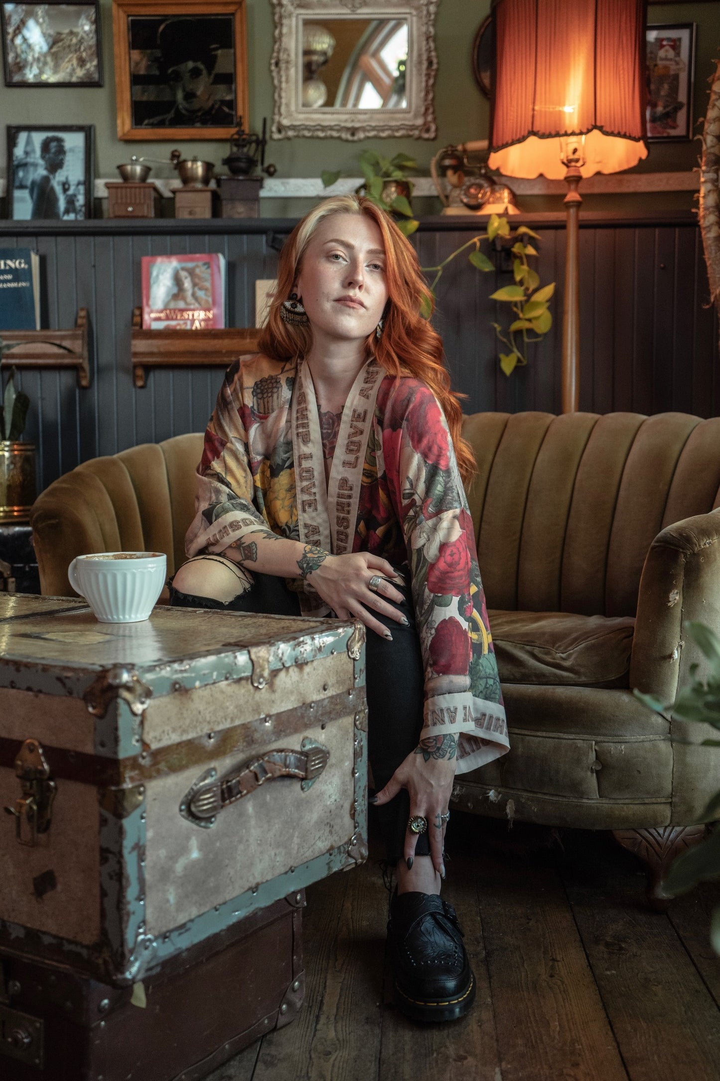 Woman with red hair wearing a Friendship Love & Truth Pixie Duster by Market of Stars, sitting in a cozy room.