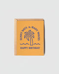 Sunny Days Many Waves Birthday Card by Daydream Prints, featuring a blue palm tree and waves on a yellow background.
