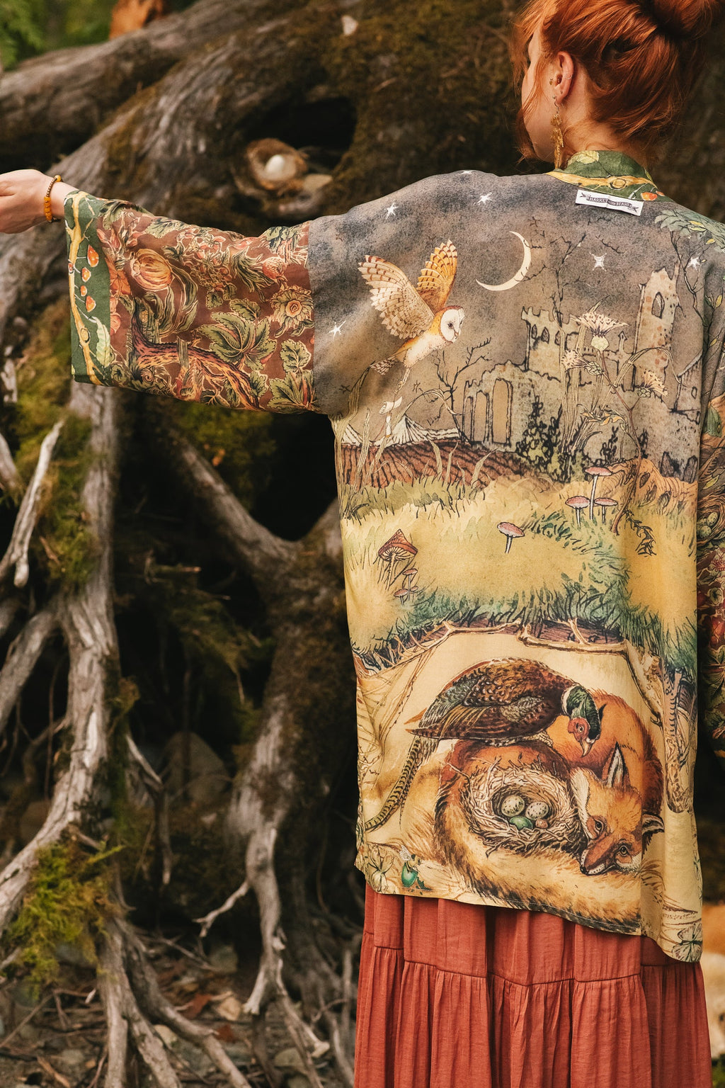 Market of Stars Woodland Wisdom Matinée Duster featuring an owl, fox, and pheasant amidst castle ruins and mushrooms.