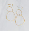 Two River Rock Earrings in 14kt Gold Fill, hammered, organic, irregular shapes, by bonnieboardman on white surface.