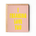 Daydream Prints I Freaking Love You Friendship Card, pink with bright yellow bold text, inside a kraft envelope.