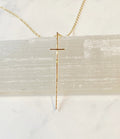 Modern Cross Necklace 14kt Gold Fill by bonnieboardman. Slender gold cross pendant on a delicate chain, resting on white selenite.