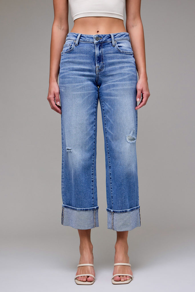 Logan Dad Jean Medium Dark | Hidden Jeans on a model, featuring a relaxed fit, distressed details, and wide cuffs.