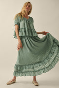 Promesa Pretty Precious Ruffle Maxi Skirt in pine green, featuring a tiered design and ruffled hem, worn by a blonde model.